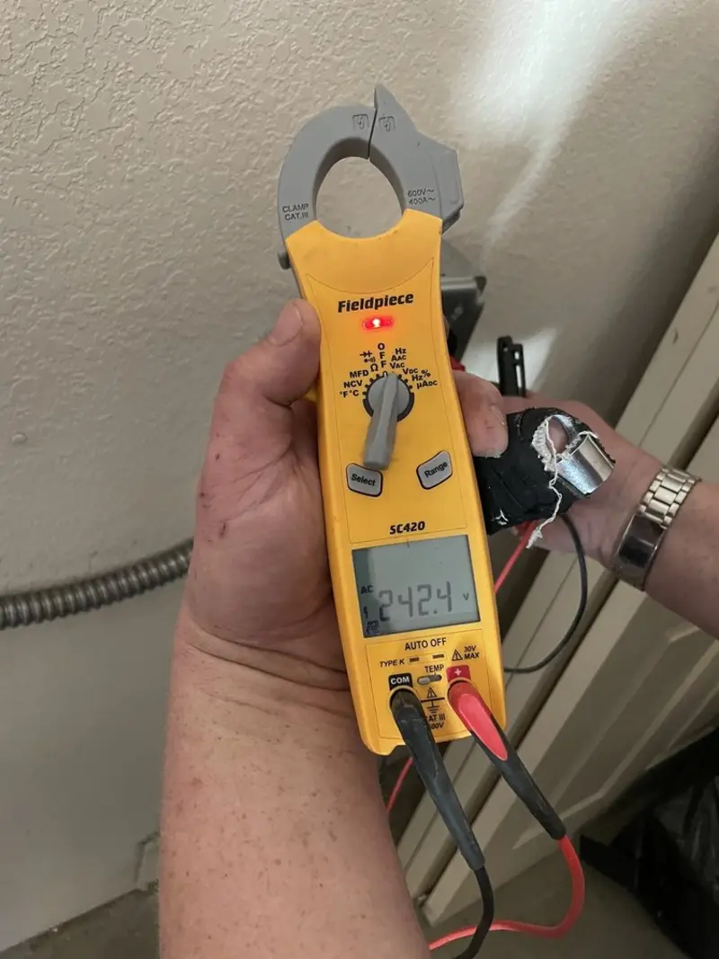 Voltage testing with clamp meter during Electrical Installation Services in Pepperdine University